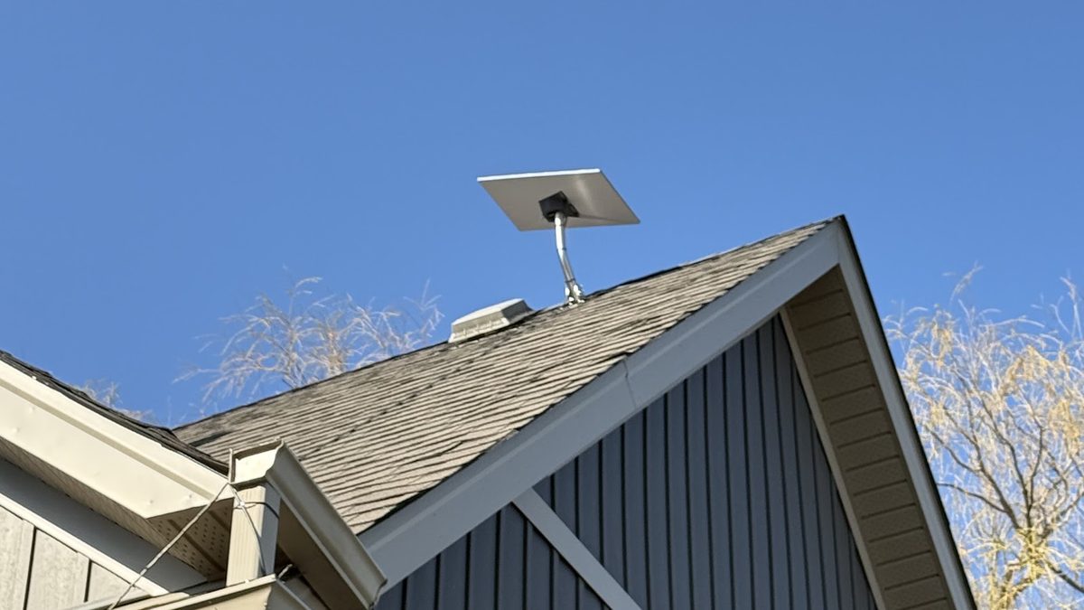 Starlink satellite dish mounted on a roof peak